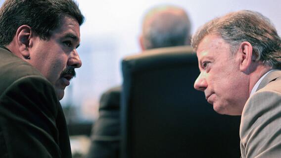 244233_Nicolás Maduro y Juan Manuel Santos / AFP