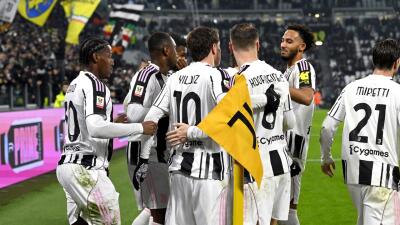 Jugadores de Juventus y un festejo de gol contra Udinese en la Copa de Italia.
