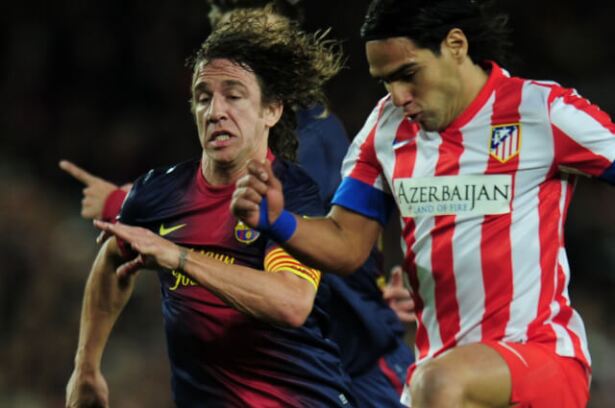 337319_puyol_falcao_220520_afp_e.jpg