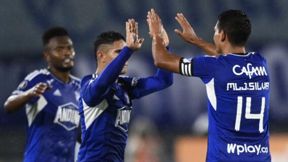 David Macasliter Silva (14) y un festejo de gol de Millonarios. David Macasliter Silva (14) y un festejo de gol de Millonarios.