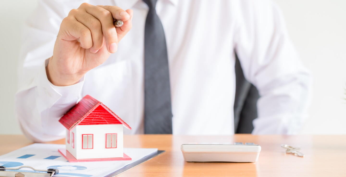 Home salesman stretches holding black pen,