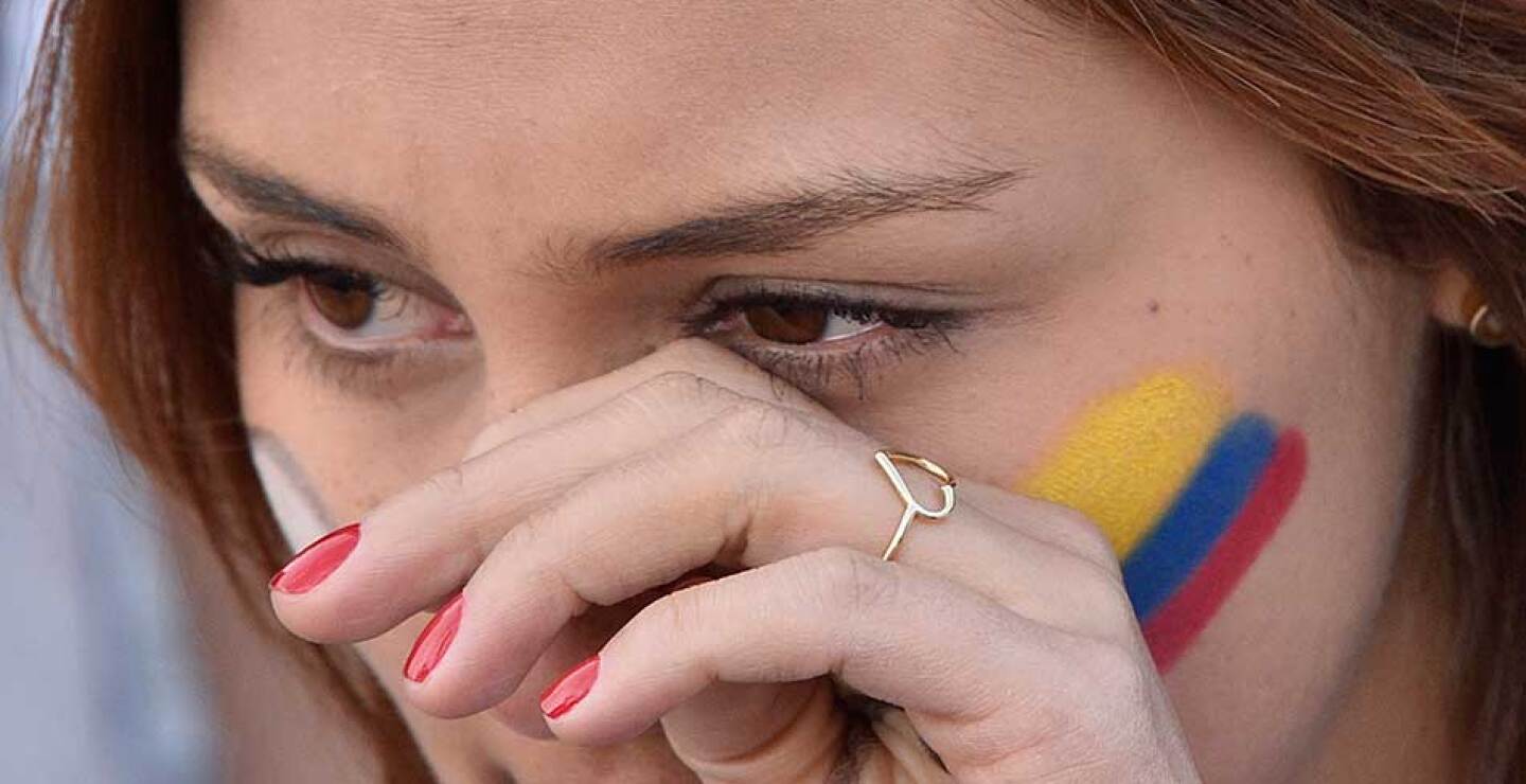 Asistentes al centro de convenciones en Cartagena se mostraron conmovidos con la ceremonia que puso fin a la guerra con las FARC.