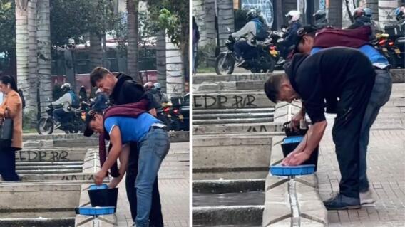 Hombres lavan pechugas de pollo en canal de aguas del centro de Bogotá Hombres lavan pechugas de pollo en canal de aguas del centro de Bogotá