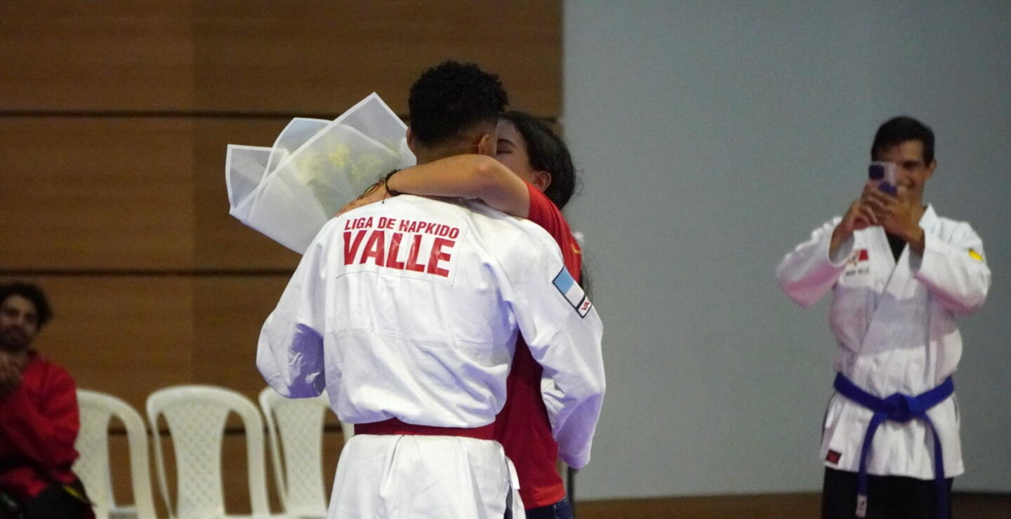 John Caracas y su pareja durante los Juegos Nacionales 2023