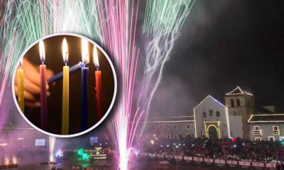 Villa de Leyva de fondo junto a una velitas. 