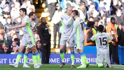 Jugadores del Manchester City y un festejo de gol contra Chelsea. 