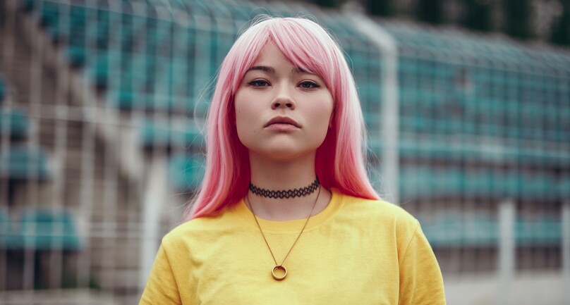 Young attractive female with pink hair