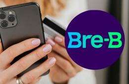 Un amujer pagando por celular junto al logo de Bre-B. 
