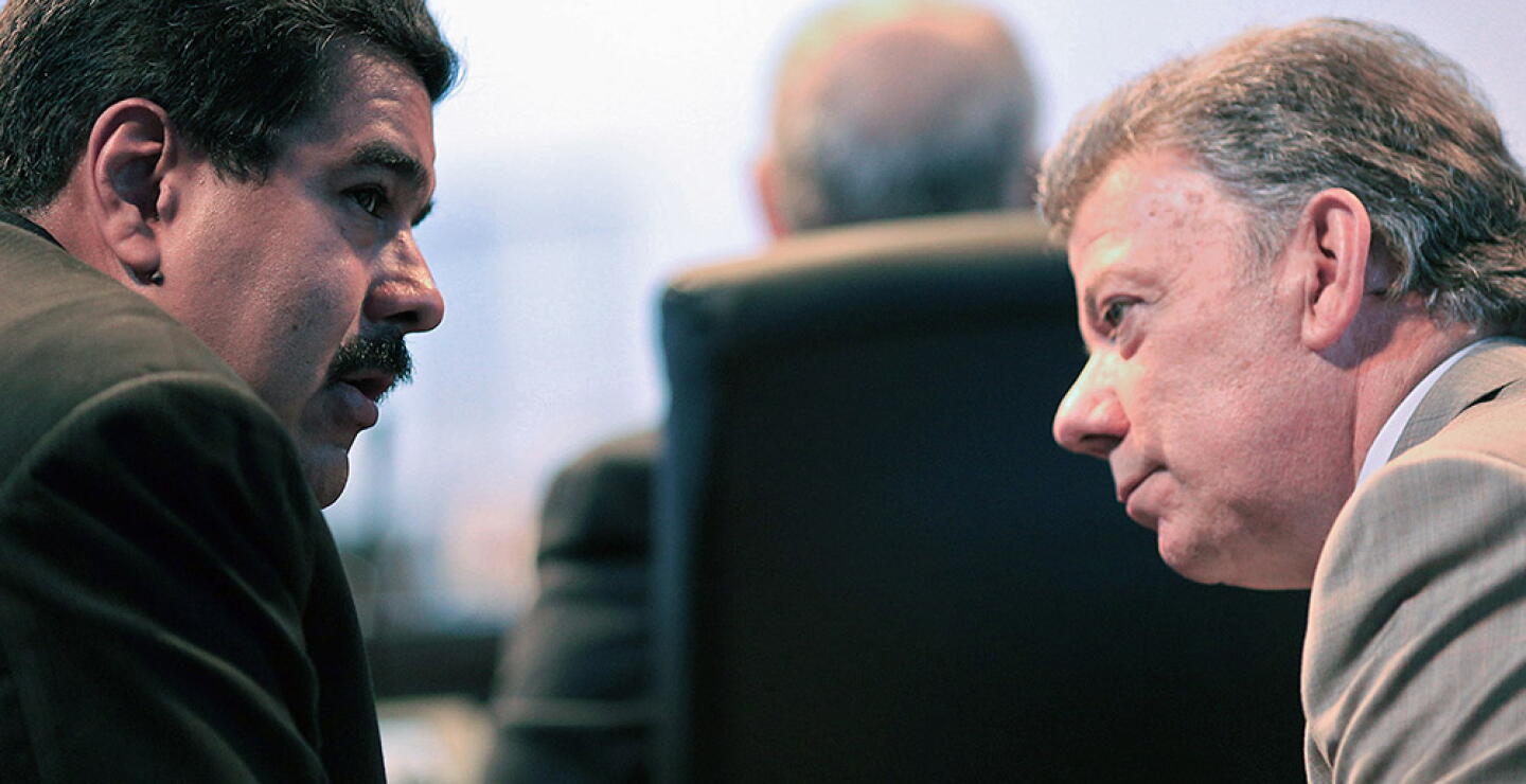 244233_Nicolás Maduro y Juan Manuel Santos / AFP