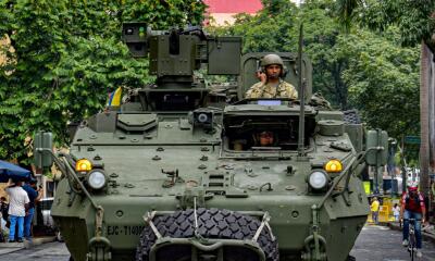 Miembros del ejército colombiano patrullan las calles como parte del plan de seguridad para la conferencia sobre biodiversidad COP16, en Cali, departamento del Valle del Cauca, 