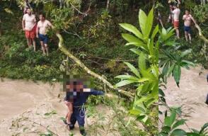 Organismos de socorro rescatan a familia atrapada por creciente súbita en río de Santander .jpg