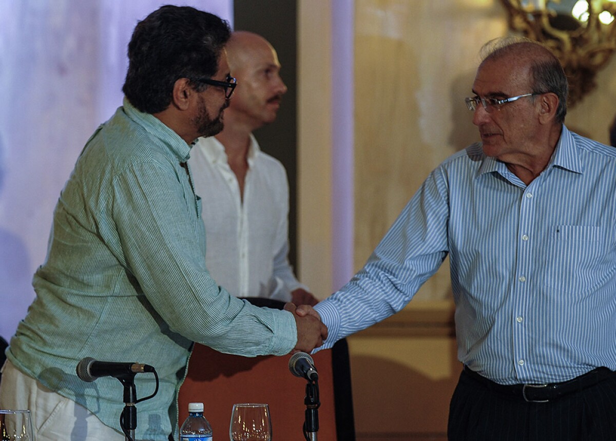 145291_Iván Márquez y Humberto de la Calle / AFP