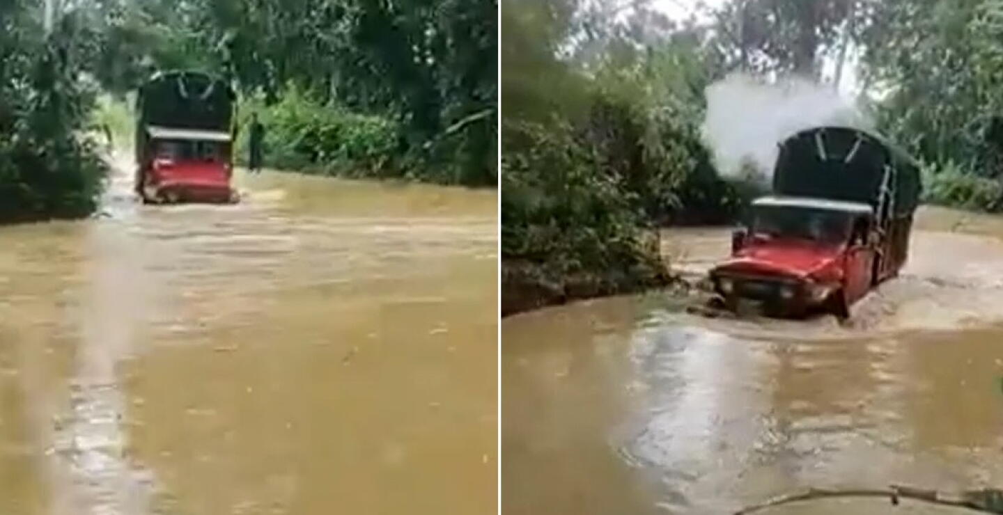 Así ‘navegan’ camiones por vía de Meta que inundó el desbordamiento de un caño